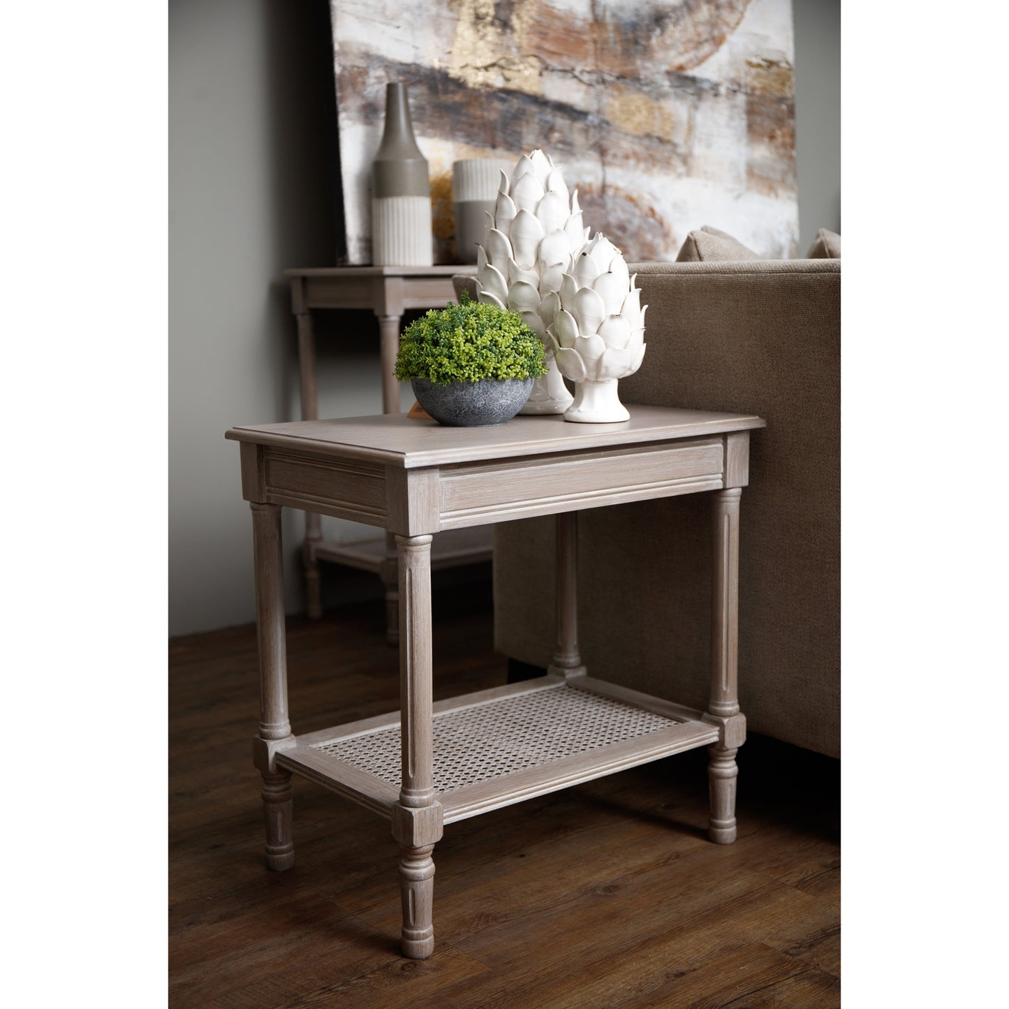 Wooden side table with decorative items in a room setting